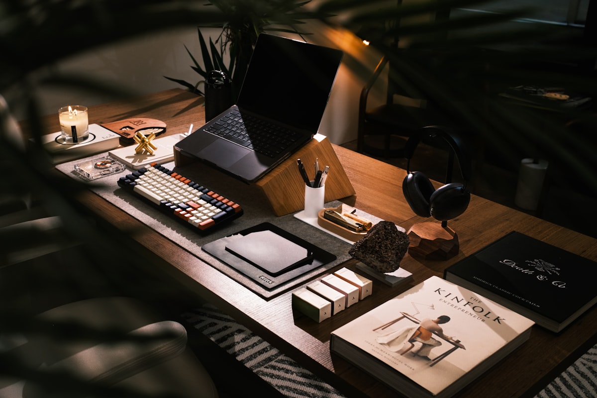 A modern desk setup with laptop and books — Gen Z treats every surface as a canvas for self-expression