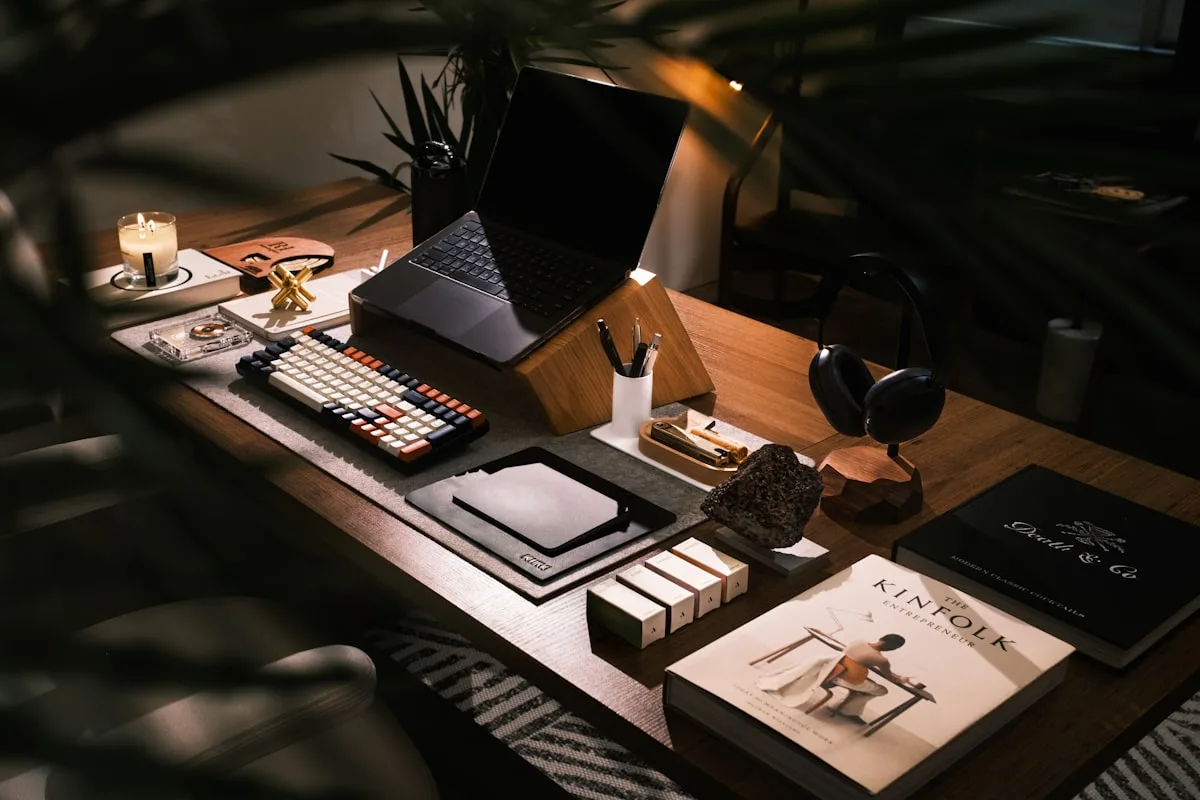 A modern desk setup with laptop and books — Gen Z treats every surface as a canvas for self-expression