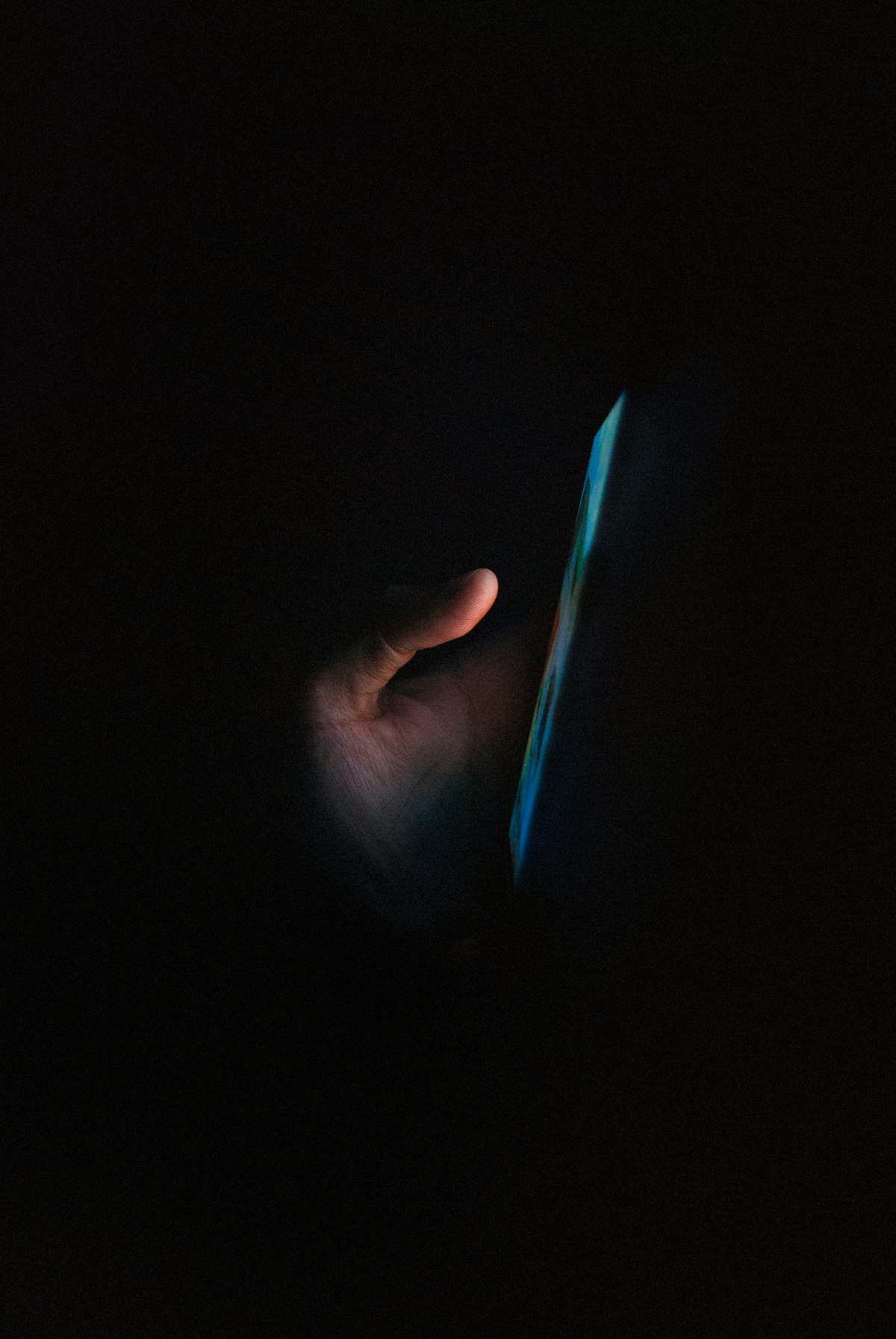 A phone glowing in the dark — your Home Screen is a self-portrait