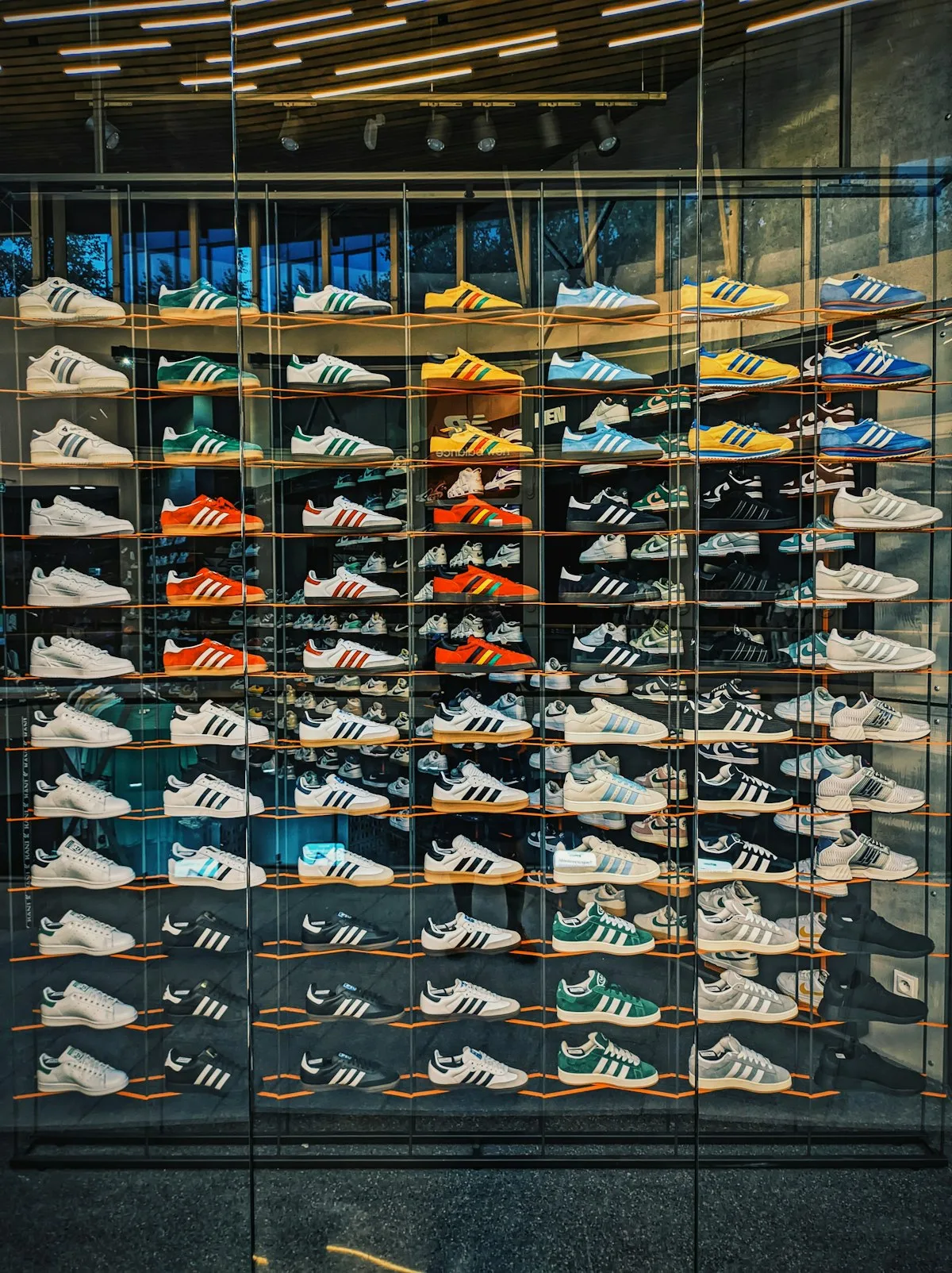 A glass display case with carefully arranged designer figures